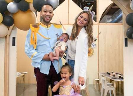 John Legend along with his wife and children